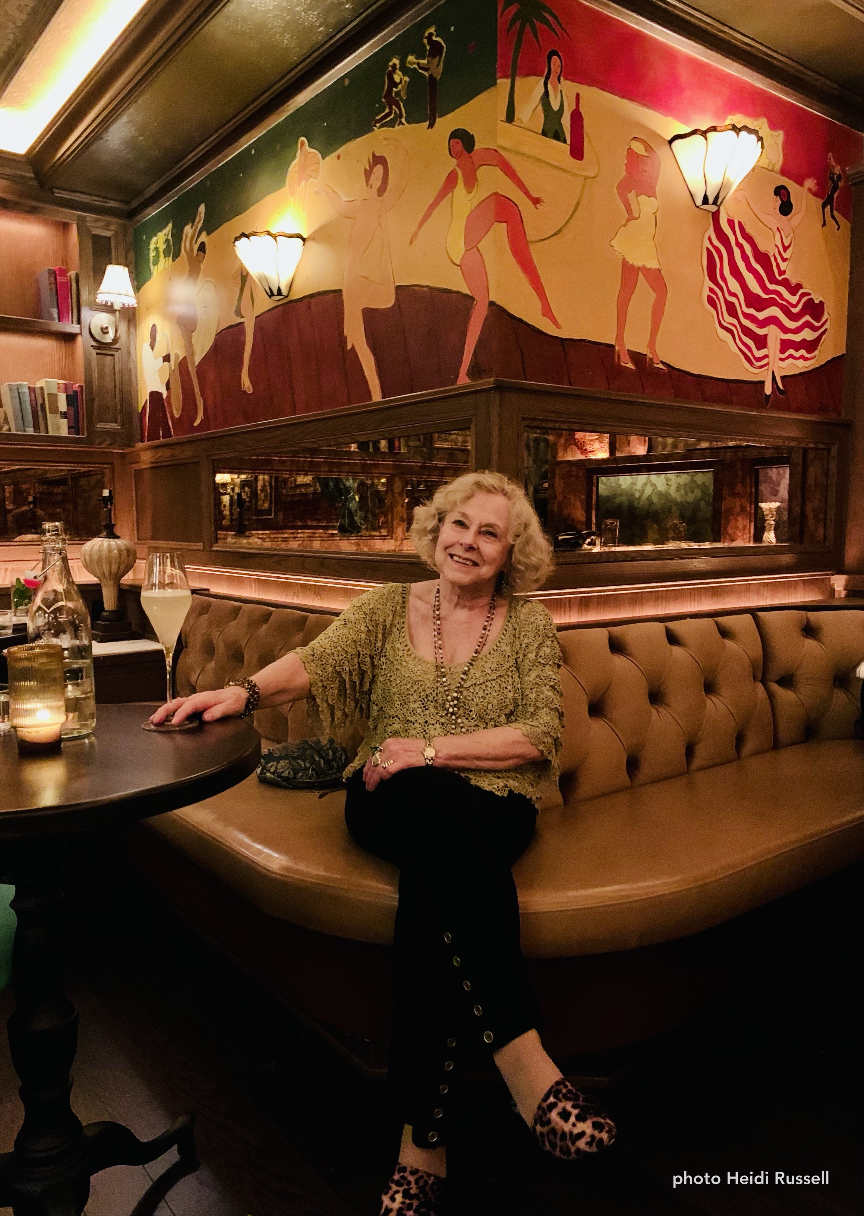 Janet at Bar Lola under her murals